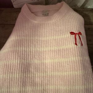 Pink Sweater with Red Bow Accent
